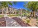 Inviting community picnic area with shaded pergola, lush green grass, and landscaped surroundings at 4516 Townwall St, Las Vegas, NV 89115