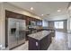 Well-equipped kitchen with stainless steel appliances, granite countertops, and center island at 4516 Townwall St, Las Vegas, NV 89115