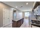 Kitchen with island, stainless appliances, and tile backsplash at 4516 Townwall St, Las Vegas, NV 89115