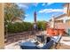 Landscaped backyard with stone accents, an outdoor seating area, umbrellas, and a relaxing hot tub at 4631 Forest Shadow Ave, Las Vegas, NV 89139