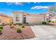 Charming single-story home with a well-maintained yard and a two-car garage, set against a beautiful blue sky at 4631 Forest Shadow Ave, Las Vegas, NV 89139