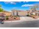 Well-kept single-story residence with an attached garage, neat landscaping, and a driveway, offering curb appeal at 4631 Forest Shadow Ave, Las Vegas, NV 89139