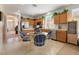 Bright eat-in kitchen features wood cabinets, stainless appliances, and lots of natural light at 4631 Forest Shadow Ave, Las Vegas, NV 89139