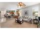 Open-concept living space blends seamlessly with the kitchen, featuring comfortable seating and a dining area at 4631 Forest Shadow Ave, Las Vegas, NV 89139