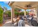 Inviting outdoor patio features covered dining space with a ceiling fan and a barbecue for outdoor cooking at 4631 Forest Shadow Ave, Las Vegas, NV 89139