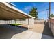 Backyard featuring covered parking, a shed, artificial turf and a gravel yard at 4670 E Boston Ave, Las Vegas, NV 89104