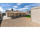 Spacious backyard featuring artificial turf, desert landscaping, and storage shed at 4670 E Boston Ave, Las Vegas, NV 89104