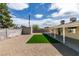 Backyard featuring a patch of artifical grass and desert landscaping at 4670 E Boston Ave, Las Vegas, NV 89104