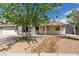 Charming single-story home with mature landscaping and a stone accent wall at 4670 E Boston Ave, Las Vegas, NV 89104