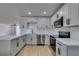 Modern kitchen featuring stainless steel appliances, quartz counters, and ample cabinet space at 4670 E Boston Ave, Las Vegas, NV 89104