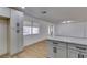Modern kitchen featuring white cabinets, quartz countertops, and stainless steel appliances at 4670 E Boston Ave, Las Vegas, NV 89104
