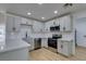 The sleek kitchen is equipped with stainless steel appliances and white subway tile backsplash at 4670 E Boston Ave, Las Vegas, NV 89104