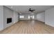 Bright living room features a modern fireplace, ceiling fan, and wood-look floors at 4670 E Boston Ave, Las Vegas, NV 89104