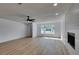 Bright living room with a large window and a modern fireplace at 4670 E Boston Ave, Las Vegas, NV 89104