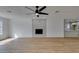 Spacious living room with a ceiling fan and a modern fireplace at 4670 E Boston Ave, Las Vegas, NV 89104