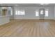 The spacious living room boasts wood-look floors and ample natural light from the backyard at 4670 E Boston Ave, Las Vegas, NV 89104