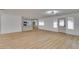 Open-concept living room with wood-look floors, seamlessly connects to the adjacent kitchen at 4670 E Boston Ave, Las Vegas, NV 89104