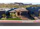 Beautiful single-story home with manicured lawn, stone accents, set in a picturesque landscape at 47 Reflection Bay Dr, Henderson, NV 89011
