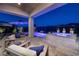 Inviting backyard with covered patio, lounge seating, and a sparkling pool and spa at 47 Reflection Bay Dr, Henderson, NV 89011