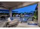 Spacious backyard featuring comfortable seating, outdoor dining, and a sparkling pool with mountain views at 47 Reflection Bay Dr, Henderson, NV 89011