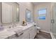 Bright bathroom with double vanity and walk-in shower at 47 Reflection Bay Dr, Henderson, NV 89011