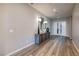 Inviting foyer featuring wood flooring, a console table, and stylish decor at 47 Reflection Bay Dr, Henderson, NV 89011