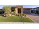 Charming home featuring desert landscaping, a brick driveway, and a stone facade at 47 Reflection Bay Dr, Henderson, NV 89011
