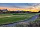 Scenic golf course view at sunset with lush green fairway for picturesque and vibrant outdoor living at 47 Reflection Bay Dr, Henderson, NV 89011