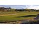 Picturesque golf course with lush green fairway and scenic mountain views for an active lifestyle at 47 Reflection Bay Dr, Henderson, NV 89011