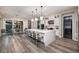 Open floor plan with a view of the kitchen with an island, stainless appliances, and dining area at 47 Reflection Bay Dr, Henderson, NV 89011