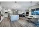 Spacious open-concept living area with a gourmet kitchen and a cozy dining space at 47 Reflection Bay Dr, Henderson, NV 89011