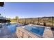 Gorgeous pool and spa combo overlooking serene lake and golf course for ultimate relaxation and enjoyment at 47 Reflection Bay Dr, Henderson, NV 89011