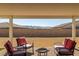 Picturesque backyard patio with comfortable chairs and mountain views, perfect for relaxing and entertaining guests at 4801 Westmont Dr, Pahrump, NV 89061