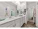 Well-lit bathroom with double vanity, decorative accents, and modern fixtures for a luxurious feel at 4801 Westmont Dr, Pahrump, NV 89061