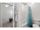 Clean bathroom shows shower-tub combo and modern fixtures with a glimpse into the connected bedroom at 4801 Westmont Dr, Pahrump, NV 89061