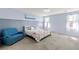 Serene bedroom with sitting area, soft carpet, and natural light, creating a relaxing retreat at 4801 Westmont Dr, Pahrump, NV 89061
