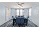 Cozy dining room features blue chairs, natural lighting, and modern decor, perfect for intimate gatherings at 4801 Westmont Dr, Pahrump, NV 89061
