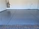 Clean and well-maintained garage floor with a smooth, epoxy coating that provides durability and aesthetic appeal at 4801 Westmont Dr, Pahrump, NV 89061