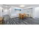 Inviting hallway with grey flooring, leads to front door and dining area, creating a welcoming entrance at 4801 Westmont Dr, Pahrump, NV 89061