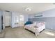 Spacious main bedroom with carpet floors, neutral wall color, and a sitting area for quiet relaxation at 4801 Westmont Dr, Pahrump, NV 89061