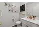 Stylish powder room with decorative artwork, modern fixtures, and a chic design at 4801 Westmont Dr, Pahrump, NV 89061