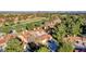 Aerial view of community showcasing lush golf course and city skyline at 5010 Longboat Cir, Las Vegas, NV 89113