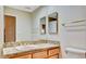 Classic bathroom showcasing granite countertops and wood cabinets for a refined look at 5010 Longboat Cir, Las Vegas, NV 89113