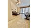 Spacious bedroom with high ceilings, a ceiling fan, tile floors, and access to the outdoors at 5010 Longboat Cir, Las Vegas, NV 89113