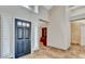 Elegant entryway showcases high ceilings and sleek tile floors, leading into the rest of this beautiful home at 5010 Longboat Cir, Las Vegas, NV 89113