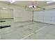 Clean garage features mirrors and storage cabinets for organization at 5010 Longboat Cir, Las Vegas, NV 89113