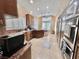 Spacious kitchen featuring custom cabinetry, granite countertops, and stainless steel appliances for modern chefs at 5010 Longboat Cir, Las Vegas, NV 89113