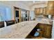Kitchen features a granite countertop and eat-in breakfast bar with seating at 5010 Longboat Cir, Las Vegas, NV 89113