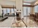 Comfortable living room with stone fireplace and marble floors, complete with a gray sofa and accent furniture at 5010 Longboat Cir, Las Vegas, NV 89113