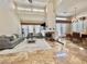 Cozy living area boasts a fireplace, large windows, and dining area at 5010 Longboat Cir, Las Vegas, NV 89113